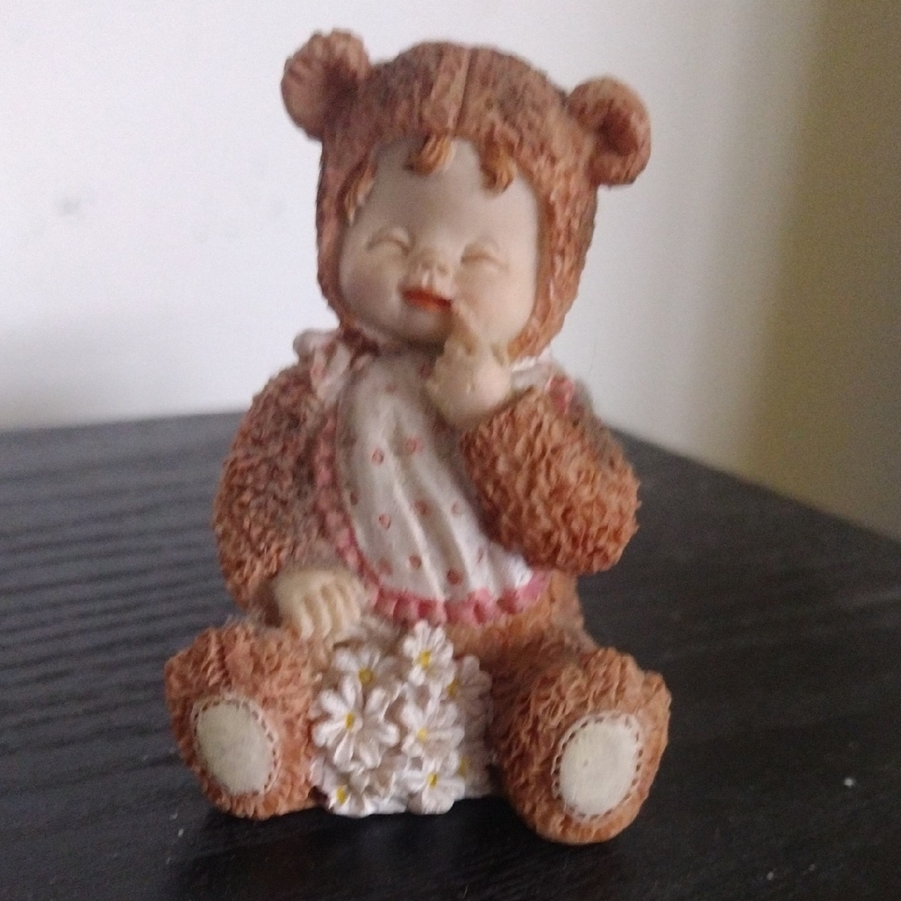 Adorable Baby Figurine Dressed As a Brown Bear with a Bib and Flowers Statue